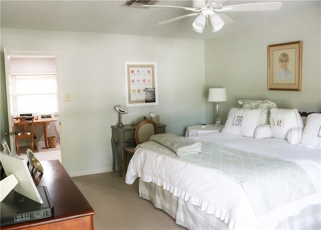 bedroom with baseboards, ceiling fan, and carpet