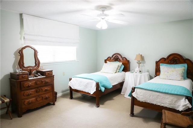 bedroom with ceiling fan and carpet floors