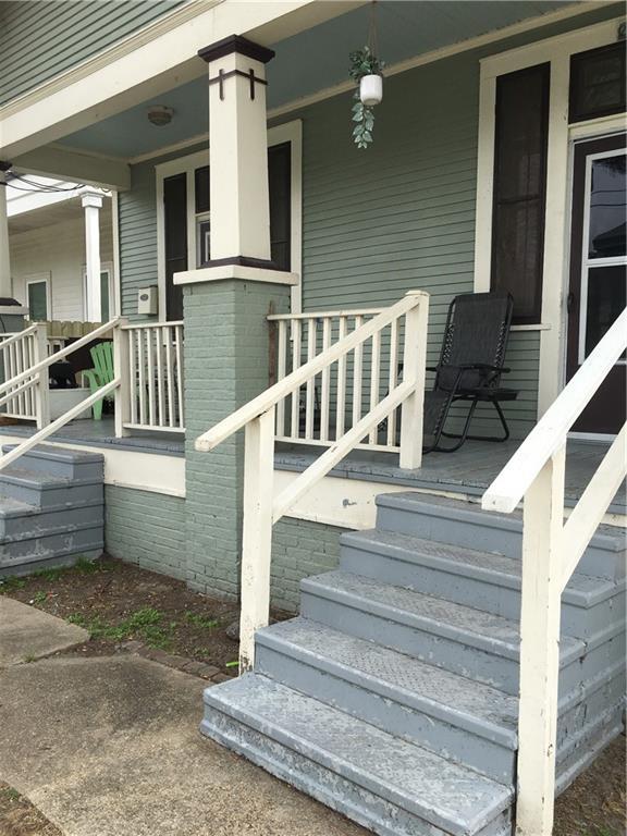 201315 Touro St, New Orleans, LA 70116 - entrance to property featuring covered porch and brick siding