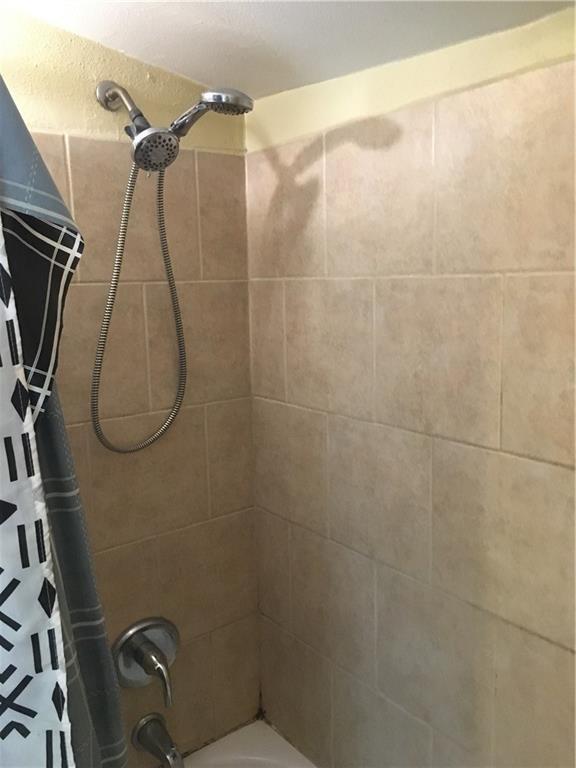 201315 Touro St, New Orleans, LA 70116 - full bath featuring shower / bathtub combination with curtain