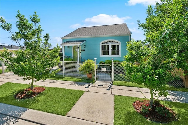 704 Sumner St, New Orleans, LA 70114 - view of front of property with a shingled roof and a gate