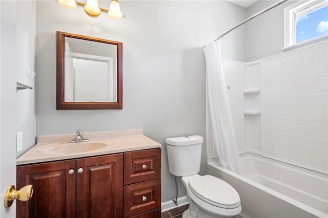 full bath with toilet, vanity, shower / bath combo with shower curtain, and baseboards
