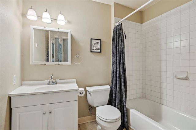 bathroom featuring toilet, shower / tub combo, vanity, and baseboards
