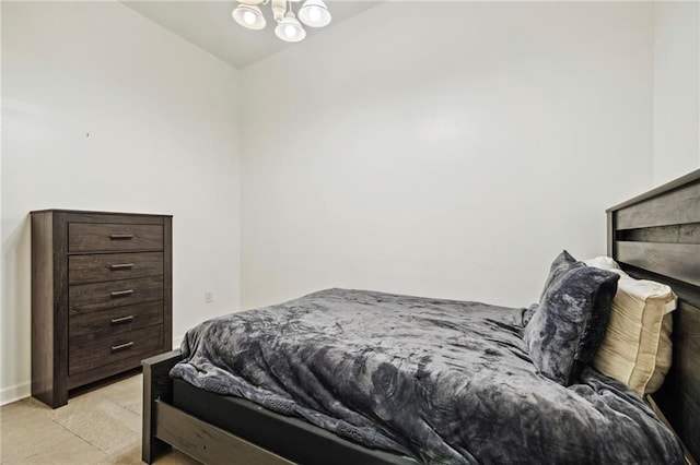 bedroom featuring a chandelier
