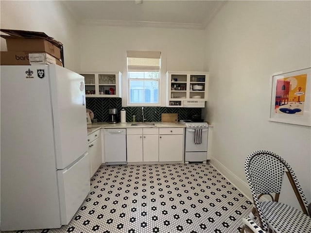 kitchen with open shelves, crown molding, a sink, and white appliances
