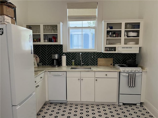 kitchen with a sink, white appliances, open shelves, under cabinet range hood, and light countertops