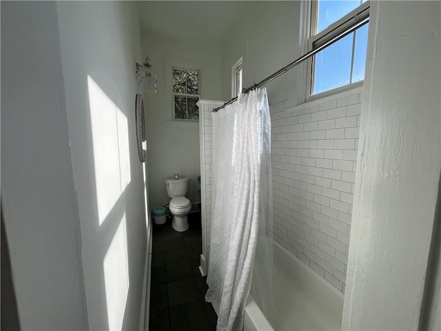 full bathroom featuring toilet, tile patterned flooring, and shower / bath combo