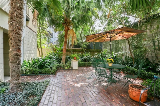 view of patio / terrace featuring outdoor dining space and fence