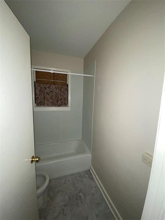 122628 Carondelet St, New Orleans, LA 70130 - full bathroom featuring toilet,  shower combination, and baseboards