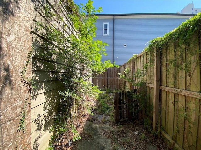 122628 Carondelet St, New Orleans, LA 70130 - view of side of home featuring a fenced backyard