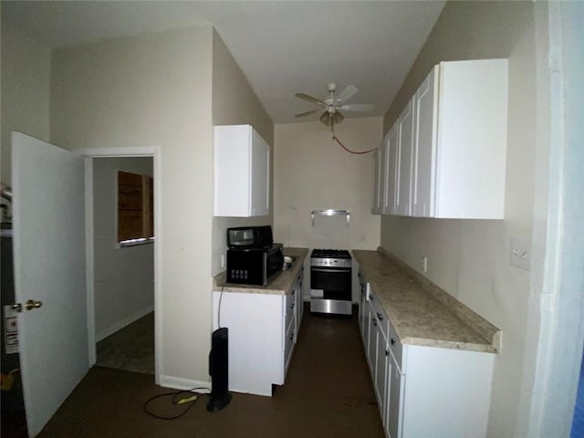 122628 Carondelet St, New Orleans, LA 70130 - kitchen featuring stainless steel range with gas stovetop, ceiling fan, white cabinetry, and wall oven