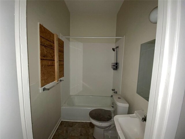 122628 Carondelet St, New Orleans, LA 70130 - bathroom with toilet, shower / bathing tub combination, baseboards, and a sink
