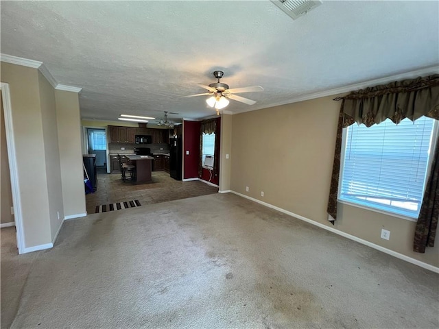 119 Carr Dr, Slidell, LA 70458 - unfurnished living room featuring ceiling fan, baseboards, and visible vents