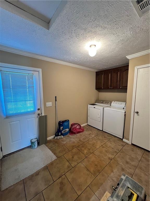 119 Carr Dr, Slidell, LA 70458 - laundry room featuring separate washer and dryer, cabinet space, and light tile patterned floors