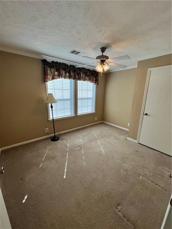 119 Carr Dr, Slidell, LA 70458 - unfurnished room featuring a textured ceiling, baseboards, ceiling fan, visible vents, and light carpet