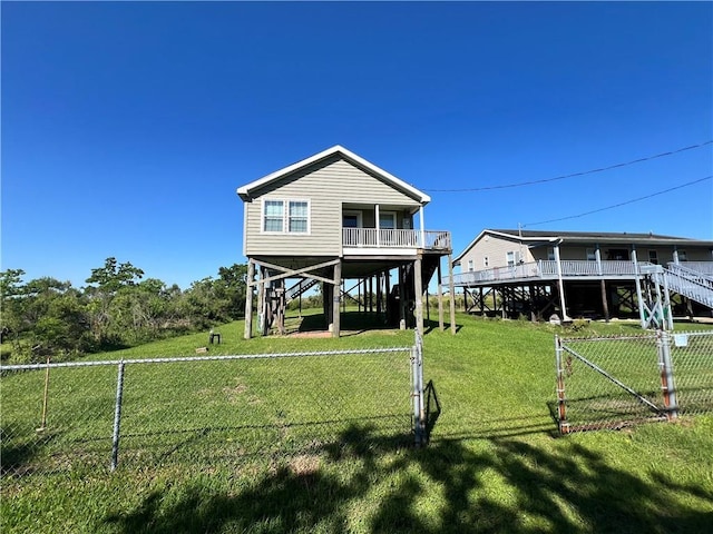 119 Carr Dr, Slidell, LA 70458 - rear view of property featuring a yard, fence, and stairs