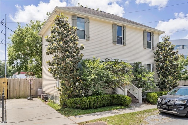 7468 Pitt St, New Orleans, LA 70118 - view of home's exterior with fence and stairs