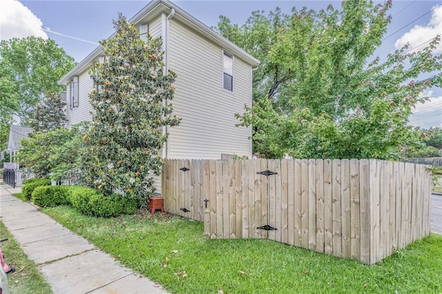 7468 Pitt St, New Orleans, LA 70118 - view of home's exterior with cooling unit, a yard, and fence