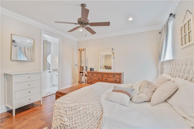 7468 Pitt St, New Orleans, LA 70118 - bedroom featuring recessed lighting, baseboards, connected bathroom, crown molding, and wood finished floors