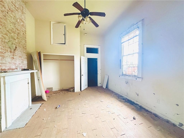 30103 Tricou St, New Orleans, LA 70117 - unfurnished living room with a towering ceiling, light wood-type flooring, and a ceiling fan