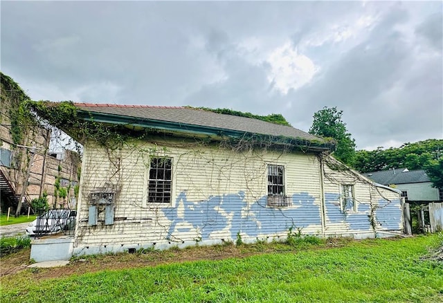 30103 Tricou St, New Orleans, LA 70117 - view of home's exterior featuring a lawn