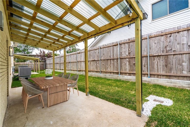 4945 Belle Dr, Metairie, LA 70006 - view of patio with central air condition unit, a pergola, a fenced backyard, and outdoor dining space