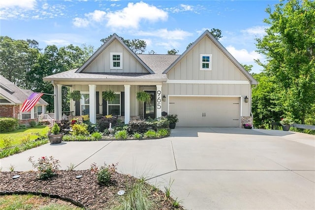 craftsman house with a porch, board and batten siding, roof with shingles, and driveway