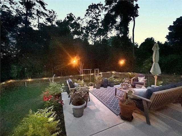965 Kino St, Diamondhead, MS 39525 - patio at twilight featuring a balcony