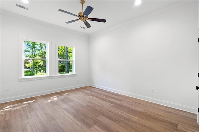 309 W 27th Ave, Covington, LA 70433 - unfurnished room featuring baseboards, light wood-style floors, visible vents, and a ceiling fan