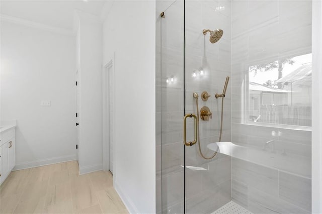 309 W 27th Ave, Covington, LA 70433 - bathroom with vanity, baseboards, a shower stall, and ornamental molding