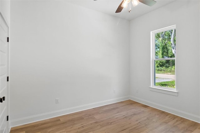 309 W 27th Ave, Covington, LA 70433 - spare room featuring light wood-style floors, baseboards, and a ceiling fan