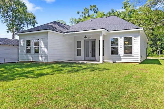 309 W 27th Ave, Covington, LA 70433 - rear view of property with a lawn, roof with shingles, french doors, and ceiling fan