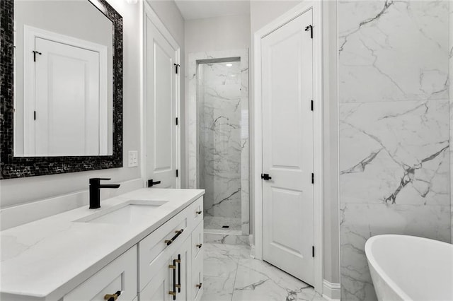 full bath with a freestanding bath, a marble finish shower, marble finish floor, and vanity