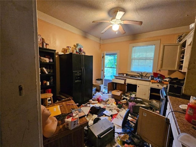 office area featuring a sink, ceiling fan, and a textured ceiling