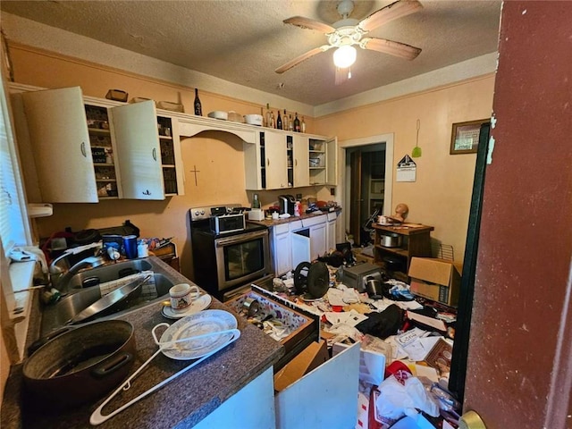 kitchen featuring ceiling fan, a textured ceiling, open shelves, and electric range