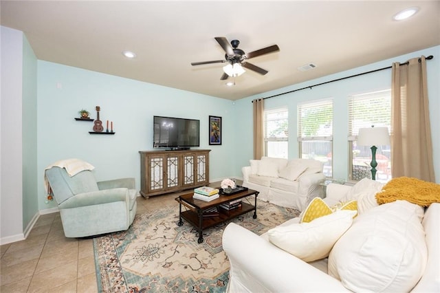 living area with a ceiling fan, visible vents, baseboards, light tile patterned flooring, and recessed lighting