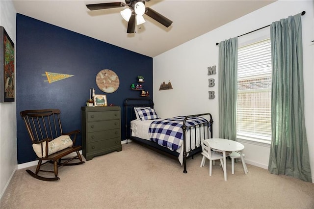 bedroom featuring vaulted ceiling, ceiling fan, carpet flooring, and baseboards