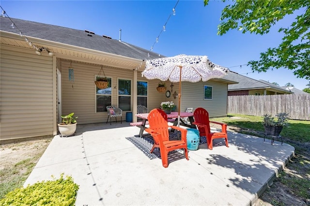 view of patio featuring fence