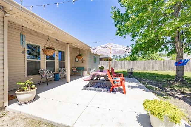 view of patio / terrace featuring outdoor dining space and fence