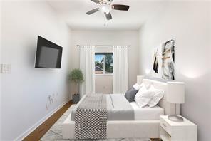 bedroom featuring baseboards, ceiling fan, and dark wood-style floors
