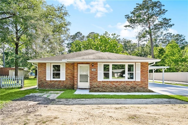 1615 Trechel Dr, Covington, LA 70433 - bungalow featuring driveway, brick siding, and fence