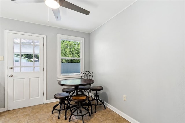 1615 Trechel Dr, Covington, LA 70433 - tiled dining space with ornamental molding, baseboards, and a ceiling fan