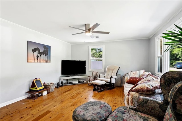 1615 Trechel Dr, Covington, LA 70433 - living area with a ceiling fan, baseboards, visible vents, crown molding, and wood finished floors