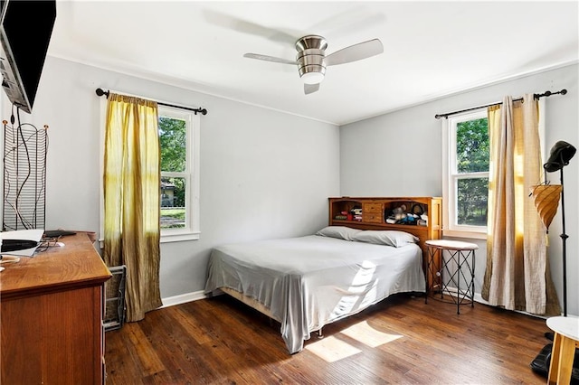 1615 Trechel Dr, Covington, LA 70433 - bedroom with ceiling fan, baseboards, and dark wood-type flooring