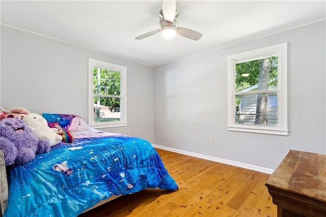 1615 Trechel Dr, Covington, LA 70433 - bedroom with baseboards, ceiling fan, and wood finished floors