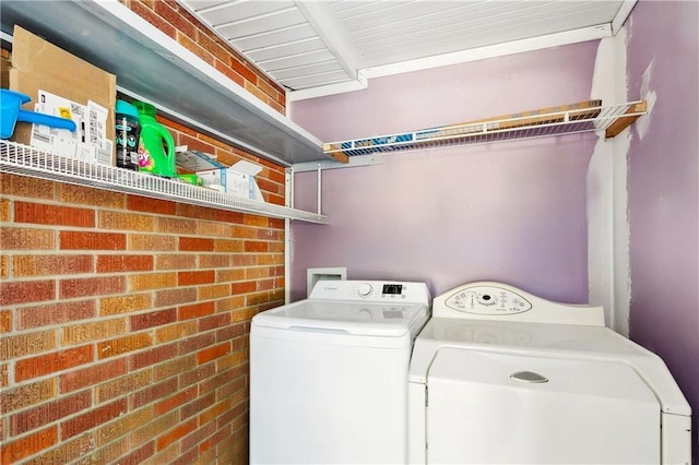 1615 Trechel Dr, Covington, LA 70433 - clothes washing area with laundry area, independent washer and dryer, and brick wall