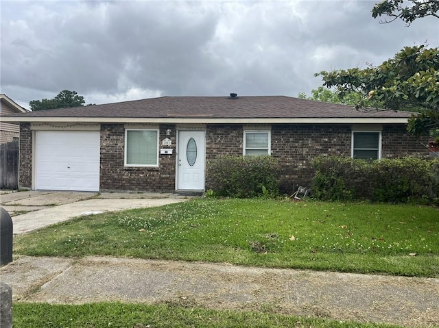 1053 Sandalwood Dr, Harvey, LA 70058 - ranch-style home with brick siding, concrete driveway, a garage, a front yard, and a shingled roof