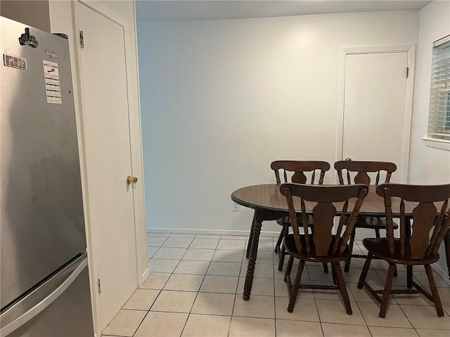 1053 Sandalwood Dr, Harvey, LA 70058 - dining room featuring baseboards and light tile patterned flooring