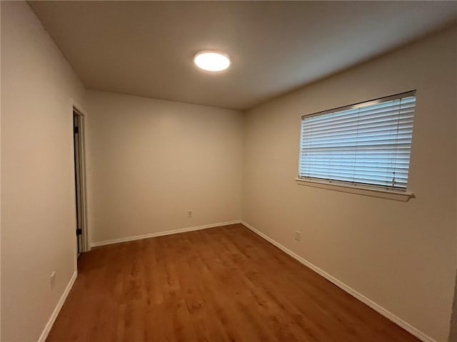 1053 Sandalwood Dr, Harvey, LA 70058 - spare room with wood finished floors and baseboards