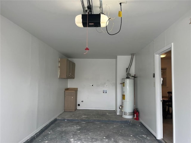 1053 Sandalwood Dr, Harvey, LA 70058 - garage featuring baseboards, a garage door opener, and gas water heater